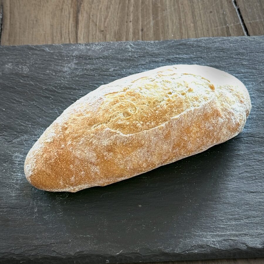 A crusty bread roll from The Globe Bakery