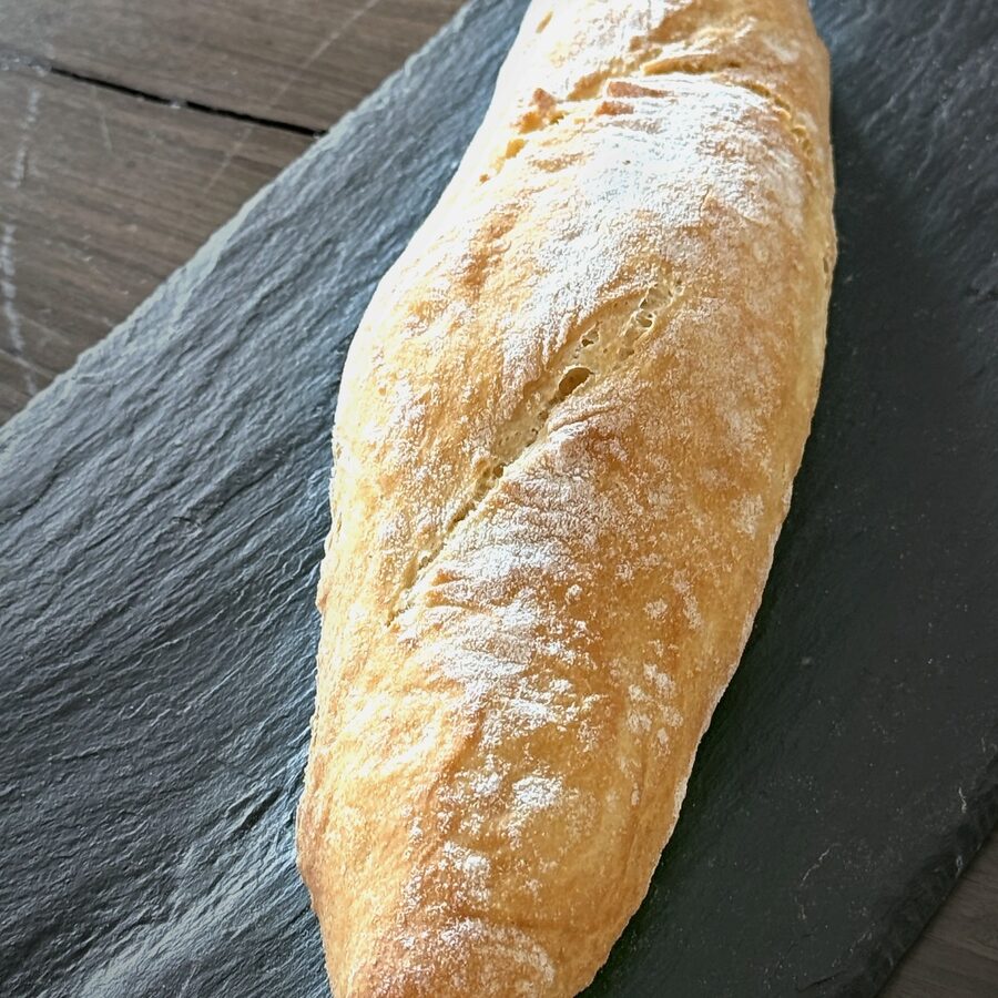 A half baguette on slate