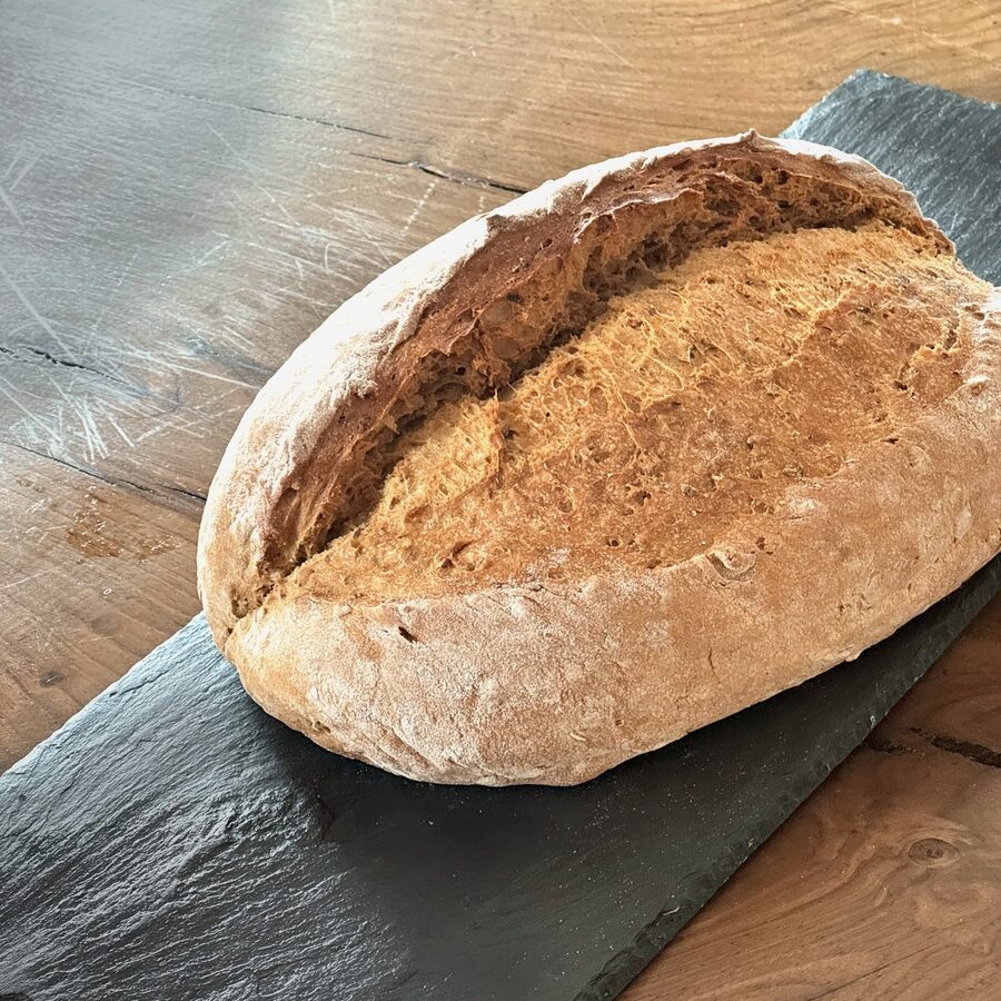 A Light Crunch loaf on slate
